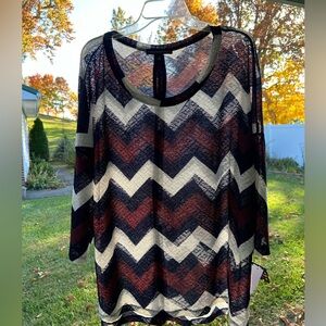 NWT top is Boho like / netted like lightweight, comfortable material stylish